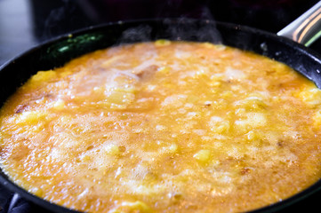 Making of Spanish tortilla, Spanish omelette tortilla de patata.