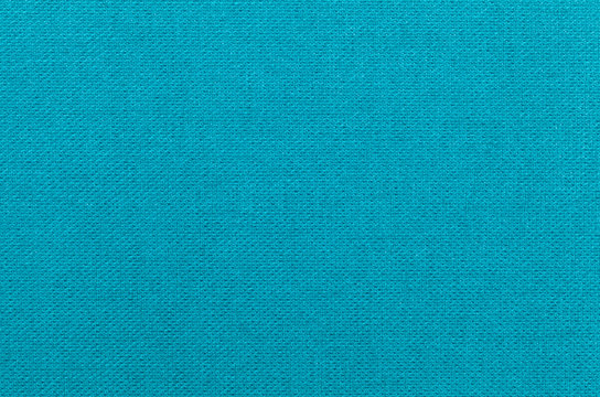 Light blue background from a textile material. Fabric with natural texture. Backdrop.