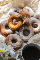 Fresh powdered sugar donuts, country style and coffee for Breakfast