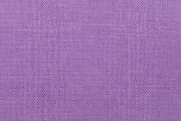 light purple background from a textile material. Fabric with natural texture. Backdrop.