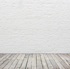 White brick wall and wood floor.