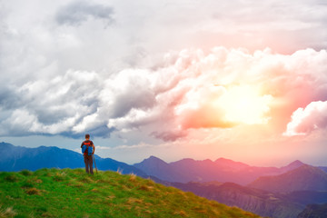 Fototapeta premium Young mountain boy observes the scene