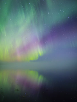 Aurora borealis over lake, Finland