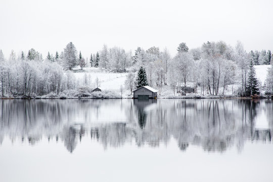 Hut on lakeside in winter, Lapland