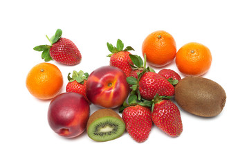 Fresh ripe fruits and berries on a white background