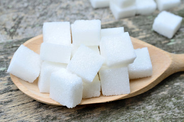 White sugar cubes in spoon