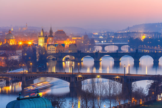 Aerial view of Old Town and bridges over Vltava River at night in Prague, Czech Republic