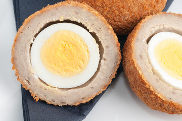 Scotch eggs a hard boiled egg wrapped in sausage meat 