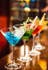 Multicolored cocktails at the bar.