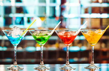 Multicolored cocktails at the bar.