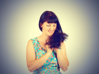 young woman looks at her problematic hairs.