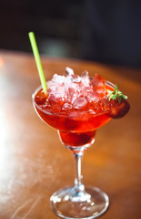 Alcoholic cocktail with strawberry.