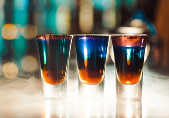 Multicolored shots on the bar