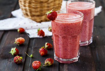 two glass of cold strawberry milk shake