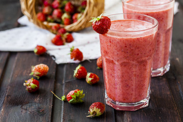 two glass of cold strawberry milk shake