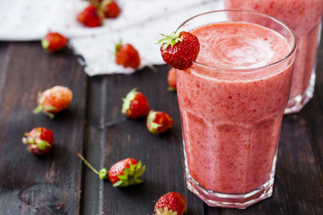 two glass of cold strawberry milk shake