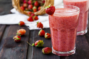 two glass of cold strawberry milk shake
