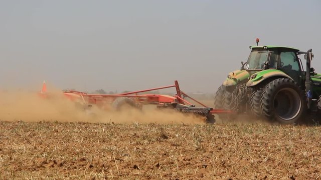 Tractor Working In The Field harvest the land