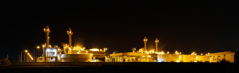 Fototapeta na wymiar Gas turbine electrical power plant at night with light
