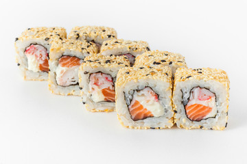 Sushi rolls with sesame seeds, cheese and salmon on a white background