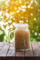 Ice coffee on a wooden table
