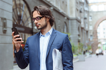 Smart man messaging on telephone