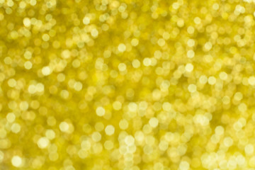 Gold glittering christmas lights. Blurred abstract background