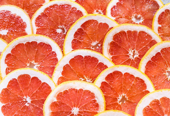 Close up of sliced grapefruit as a background.