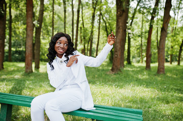 Black african american girl gesture showing something in the air