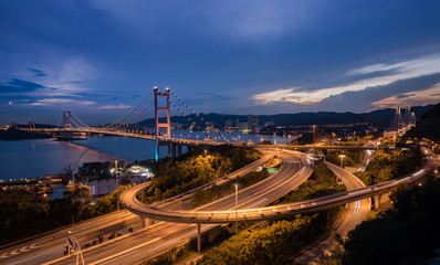 Fototapeta na wymiar Beautiful night scenes of Tsing Ma Bridge The highway road in Ho