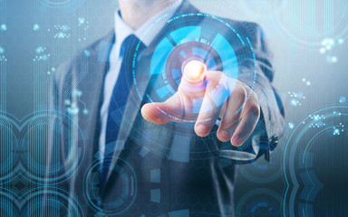 Businessman pressing virtual buttons in futuristic concept