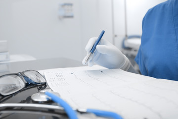 Working female doctor in hospital office