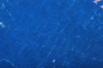 Blue textured paper background, macro