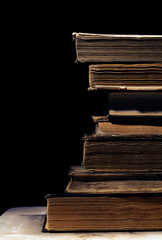 Old books on the black background