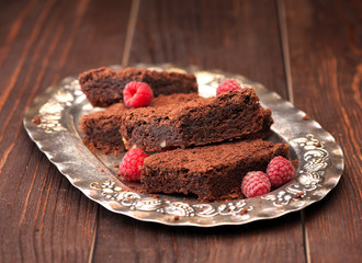 Chocolate brownie cake on a silver plate