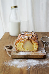 Cake with pears on a wooden table 
