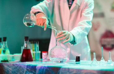 Experiments in a chemistry lab. conducting an experiment in the