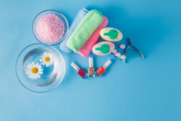Spa hands accessories on plain blue background