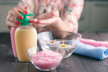 Female hands using liquid soap