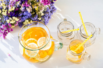 Orange and lemon lemonade with small tagerines