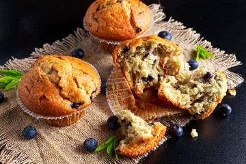 Homemade Blueberry Muffins with fresh berries and mint