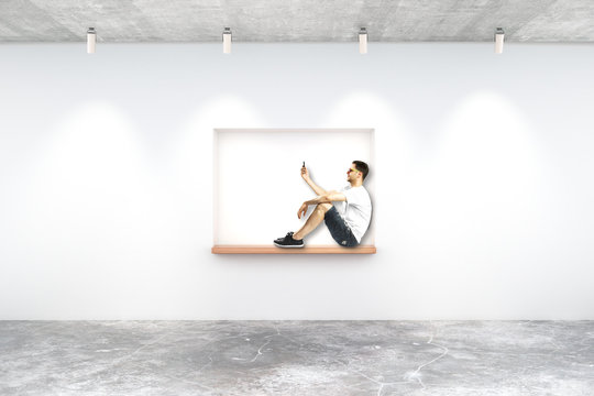 Young man on built-in-wall seating