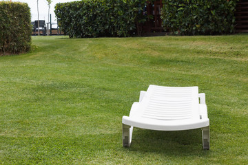 Sun-chair on a sunny lawn