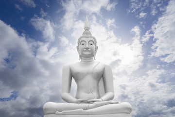 Fototapeta na wymiar white image of Buddha with blue sky and cloud in background, light effect added ,filtered image , prachuapkhirikhan,thailand