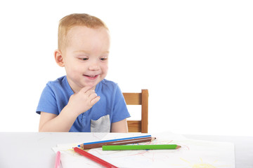 Little boy is drawing the picture