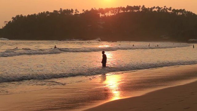Beach and sea water wave at Mirissa during sunset, Sri Lanka