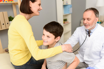Fototapeta premium Pediatrician doctor examining child