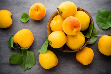 Apricots on a grey metal background.