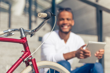 Afro American man with gadget