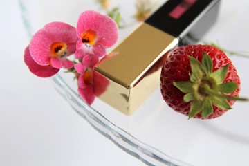 lipstick with brush. Red berry strawberry.